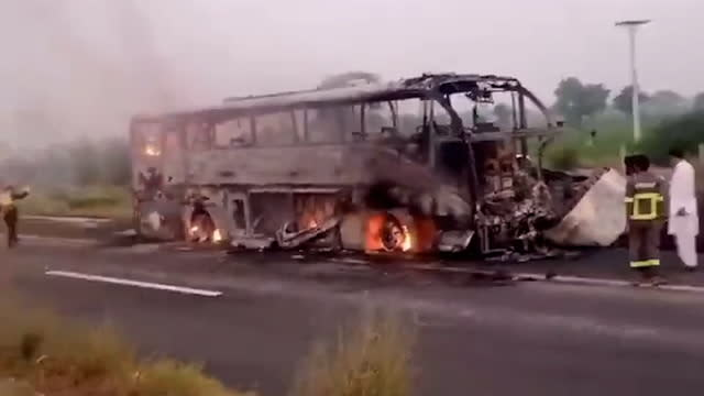 Pakistan bus bursts into flames on road hard shoulder, killing 20.