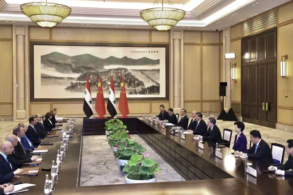 China's xi jinping meets syria's bashar al-assad, announces strategic partnership